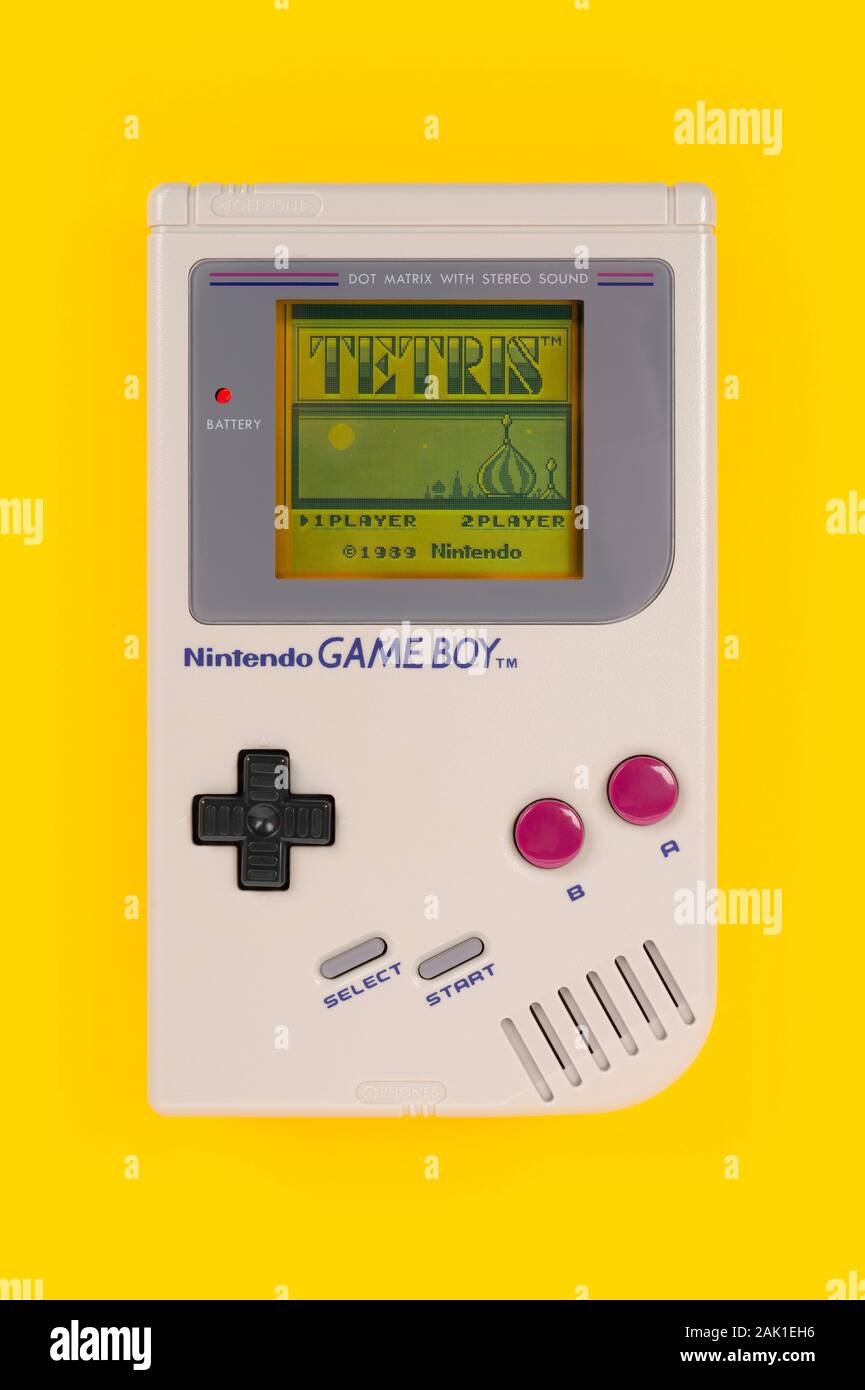 The introductory screen of the game Tetris as seen on a 1989 Nintendo Game Boy shot on a yellow background. Stock Photo