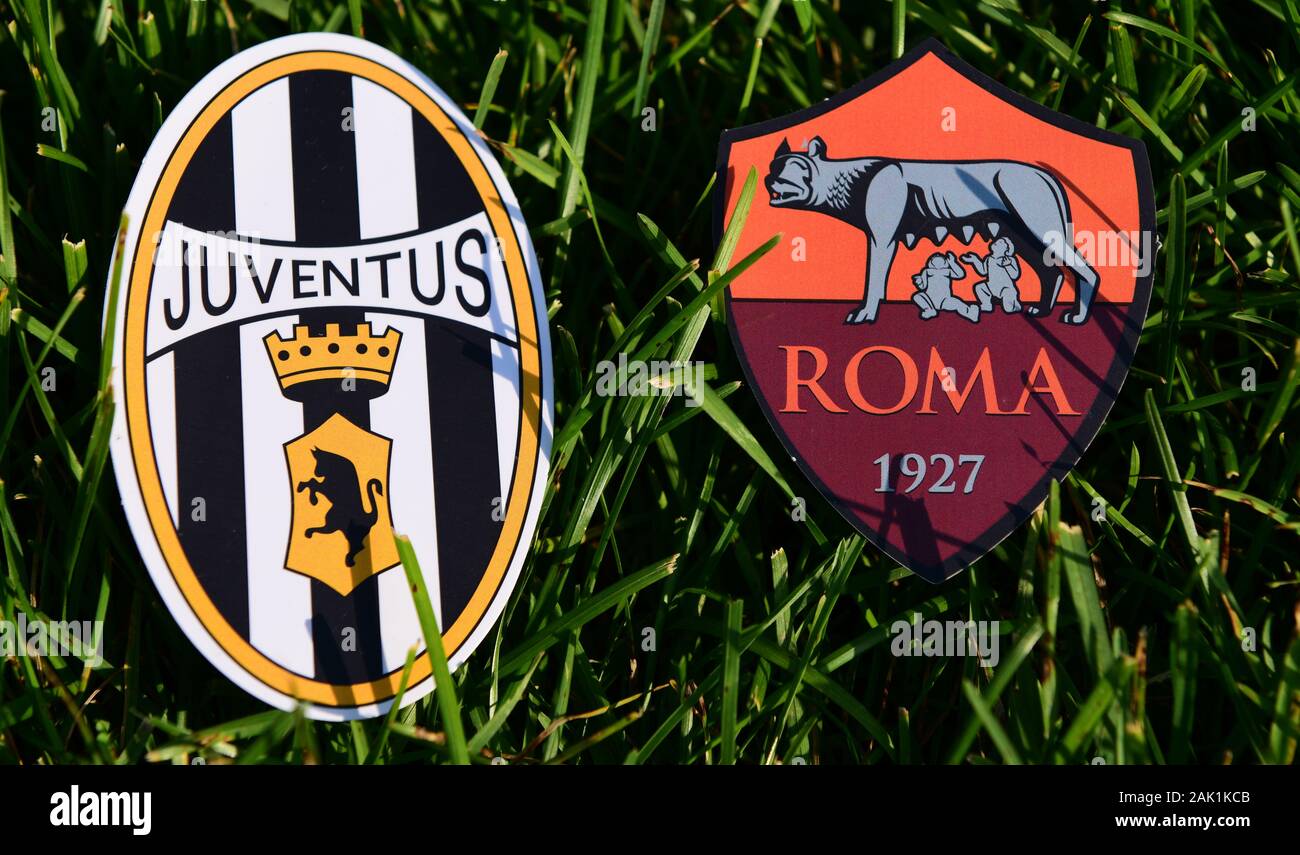 September 6, 2019, Turin, Italy. Emblems of Italian football clubs Juventus Turin and Roma on the green grass of the lawn. Stock Photo