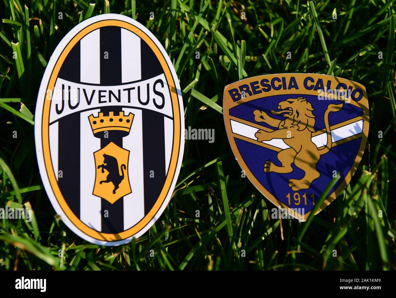 September 6, 2019, Turin, Italy. Emblems of Italian football clubs Juventus Turin and Brescia on the green grass of the lawn. Stock Photo