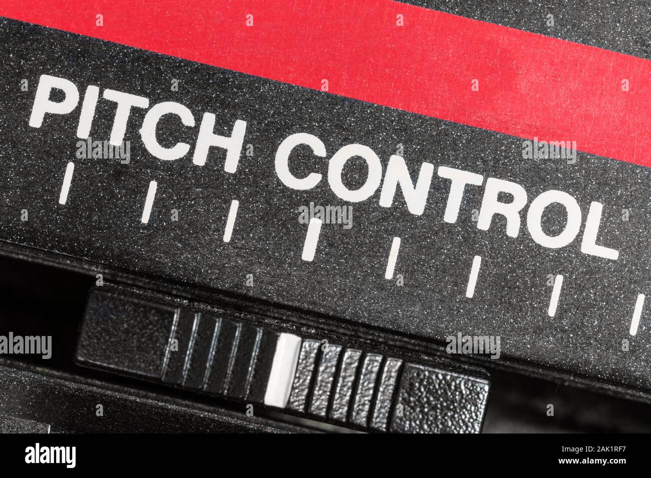 Macro close up view of vintage pitch control tape machine speed slider. Stock Photo