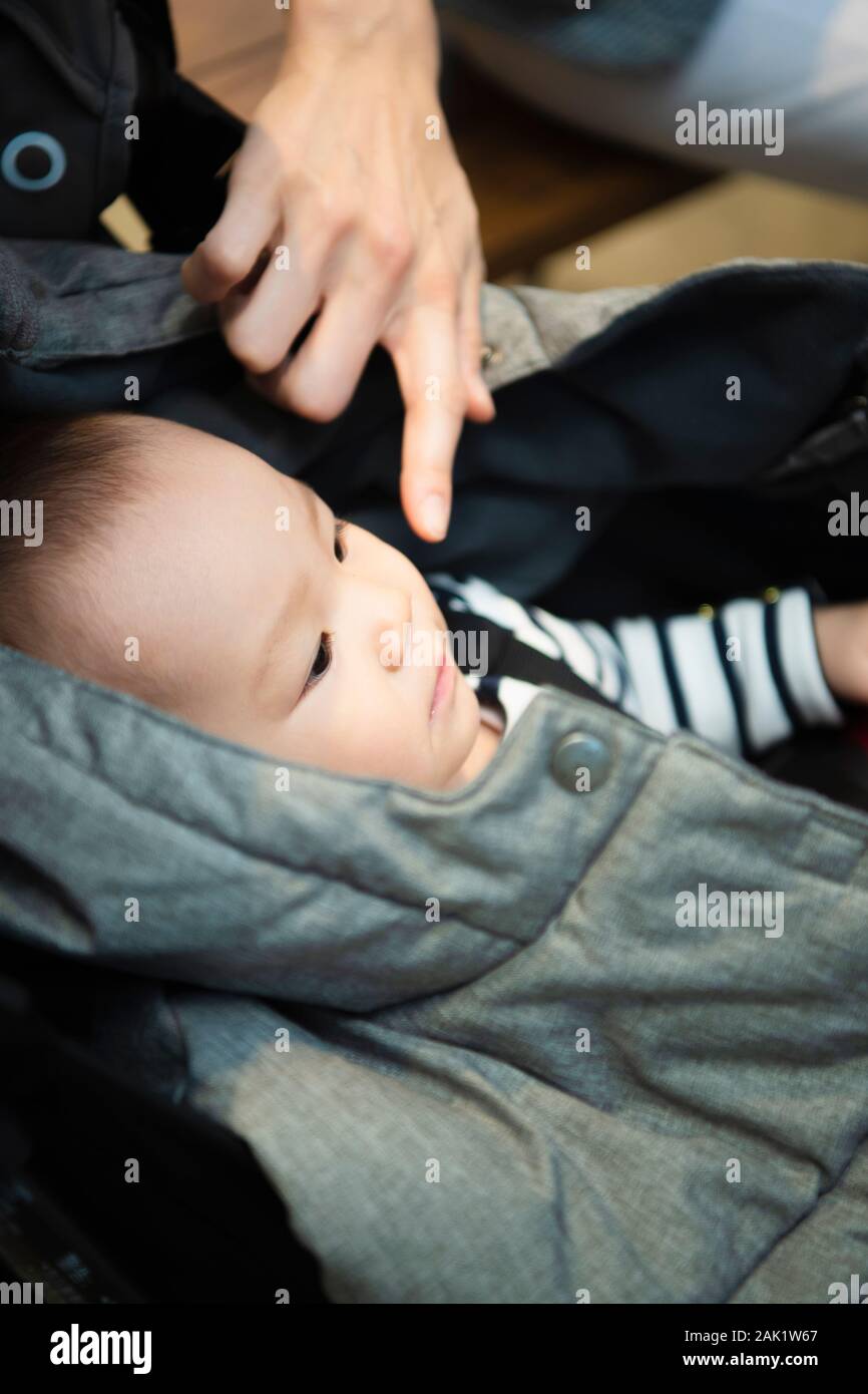 Baby sleeping in stroller Stock Photo Alamy