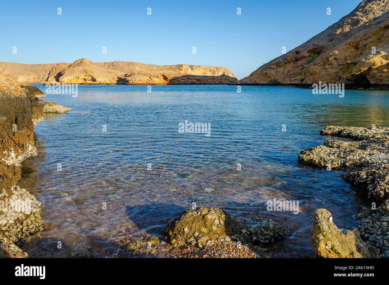 Tranquilizing view of a rocky beach in Muscat, Oman. Stock Photo