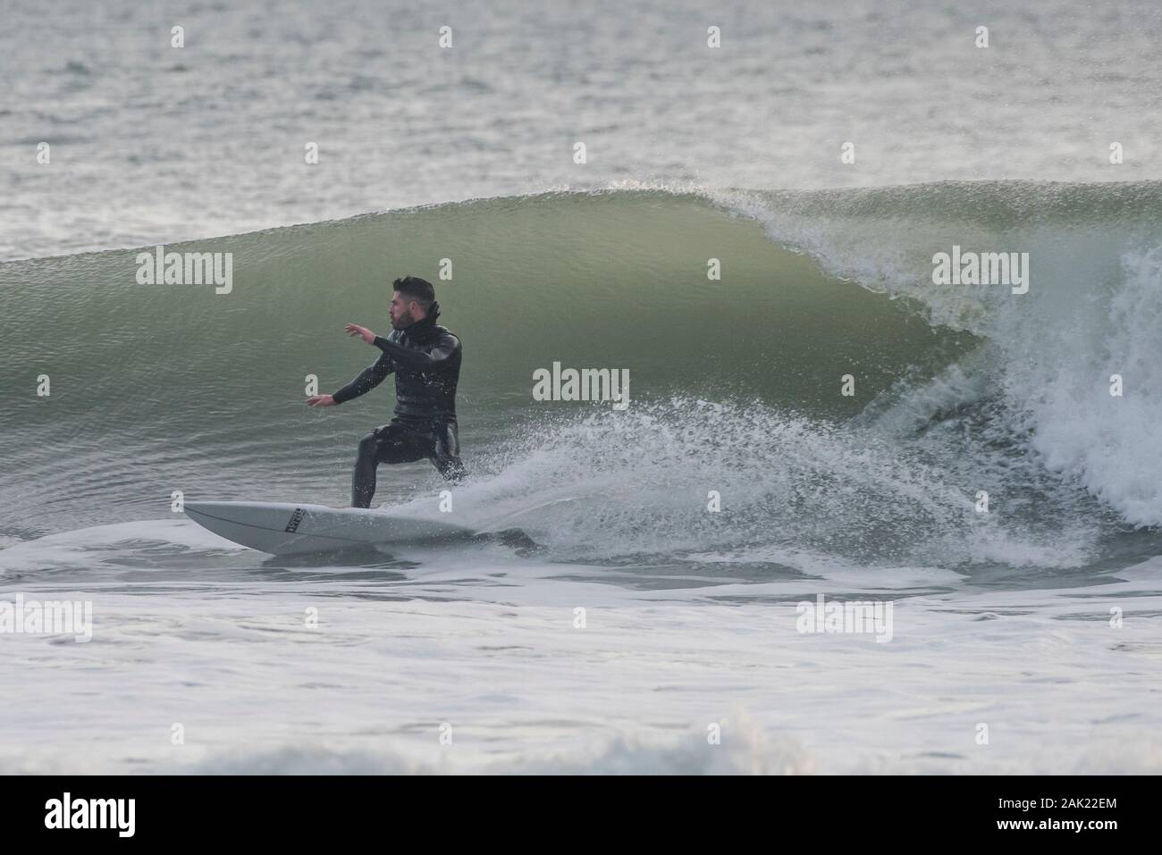 A man surfing off the coast of Ano Nuevo State park in San Mateo county in California. Stock Photo