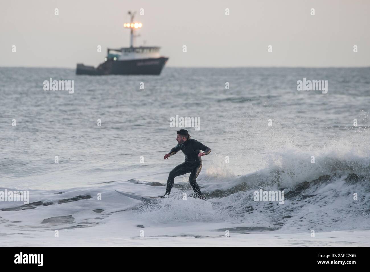 A man surfing off the coast of Ano Nuevo State park in San Mateo county in California. Stock Photo