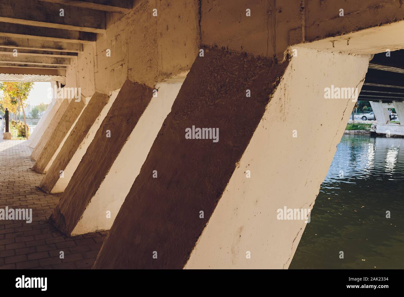 Object Under Bridge Under the bridge. The rhythm of the concrete pillars of the bridge ...