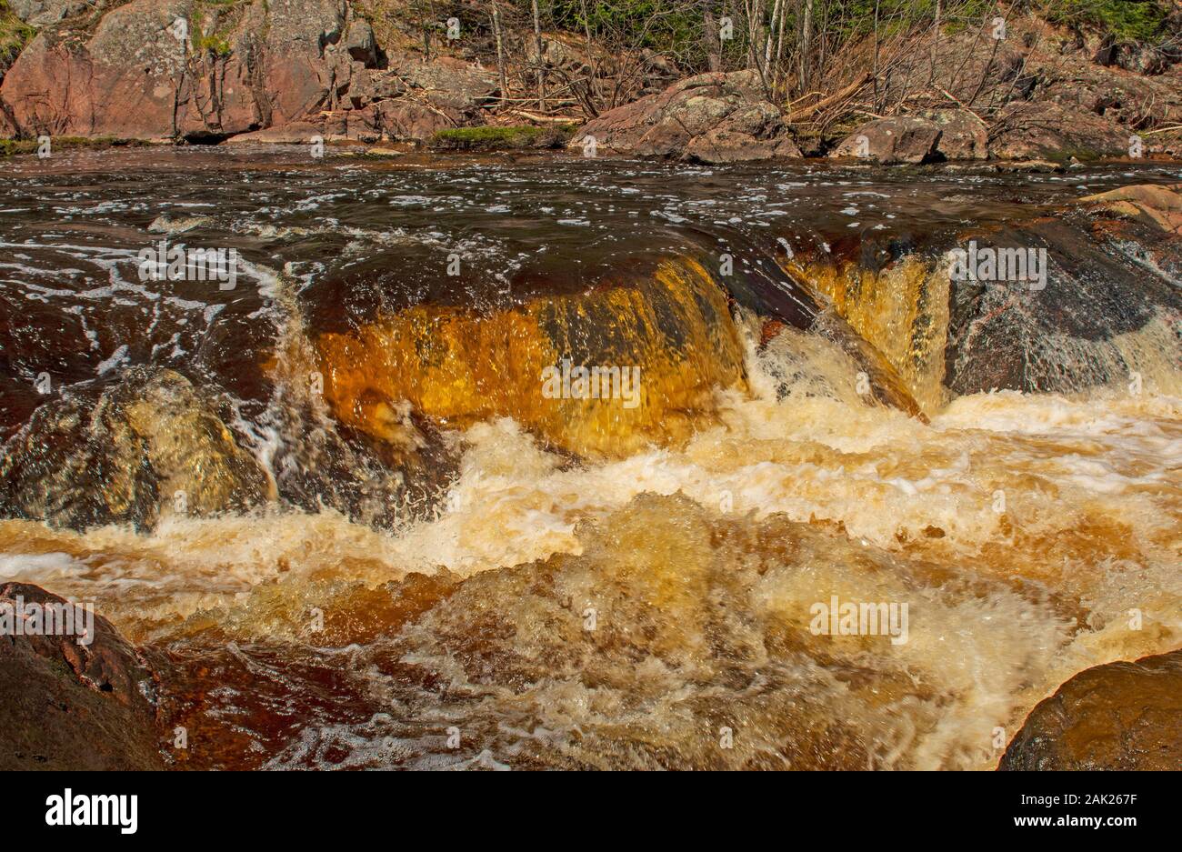 Close up of a Dramatic Fall in the Spring at the Red Granite Falls in