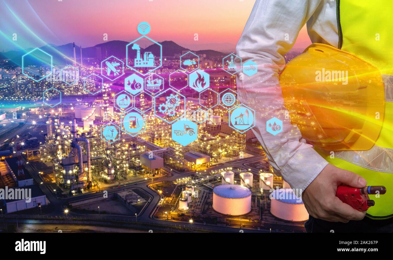 Double exposure of engineering teams is working at refinery plant as icon concept petrochemical industry. Stock Photo
