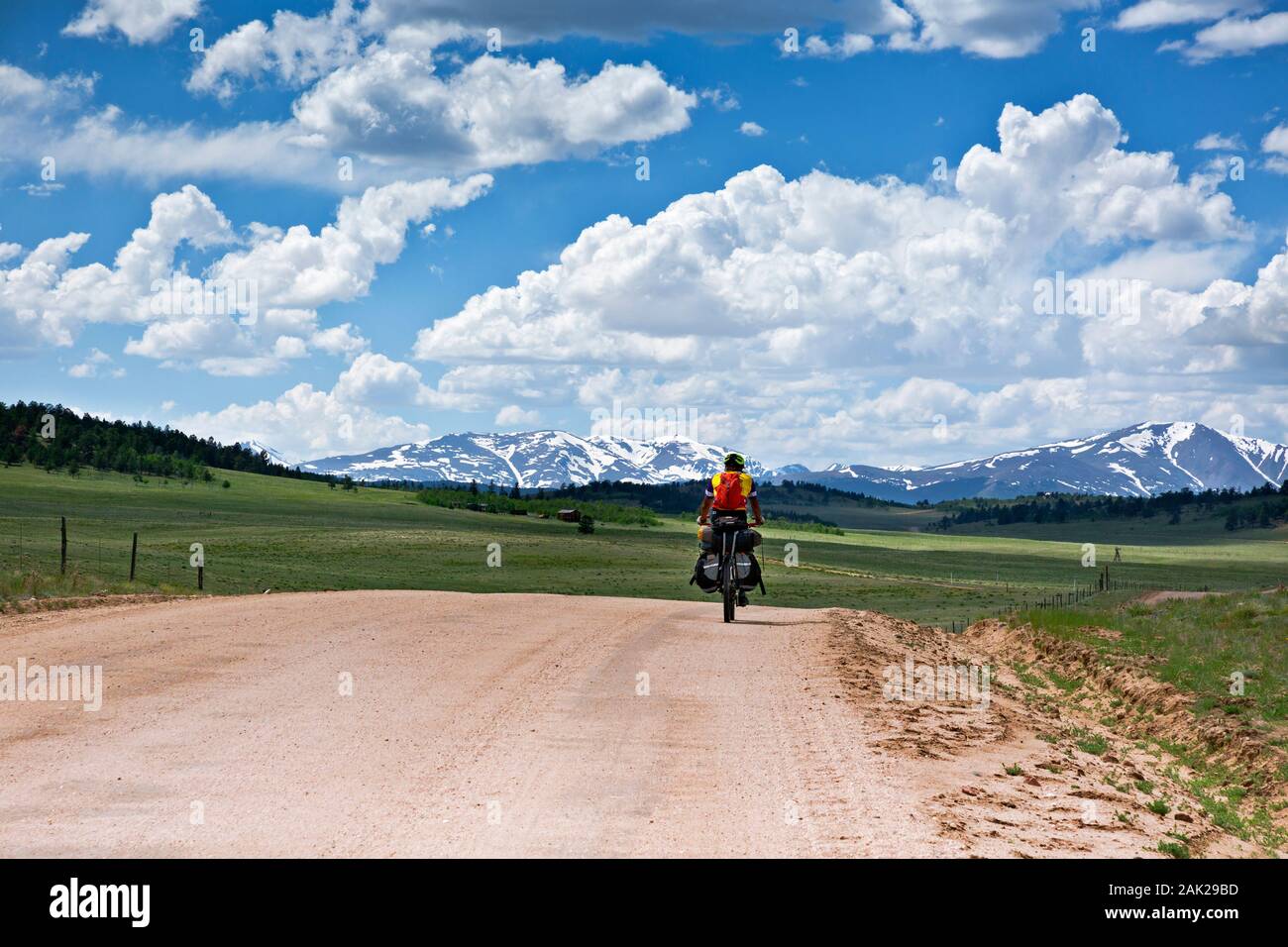 CO00182-00...COLORADO - Riding north on the Great Divide Mountain Bike Route with a view of snow-topped mountains above Hartsel. Stock Photo