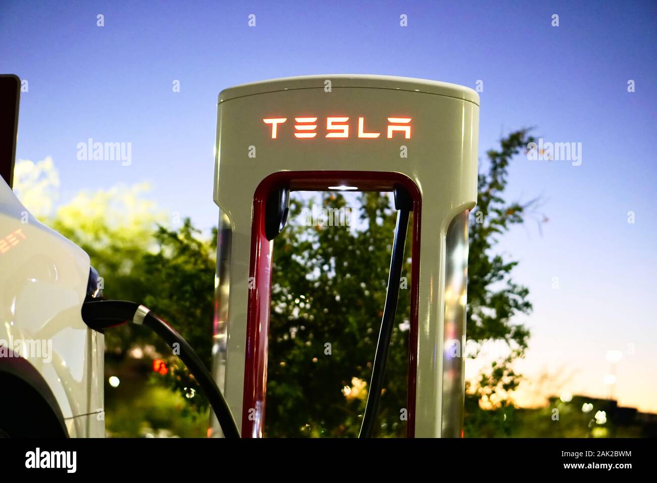 Tesla Pluggedin and Charging at Supercharger Stock Photo Alamy