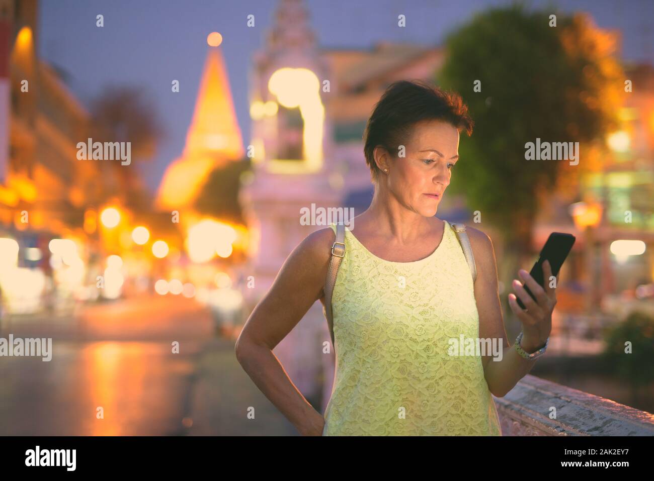 Mature beautiful Scandinavian tourist woman exploring Nakhon Pathom province in Thailand Stock Photo