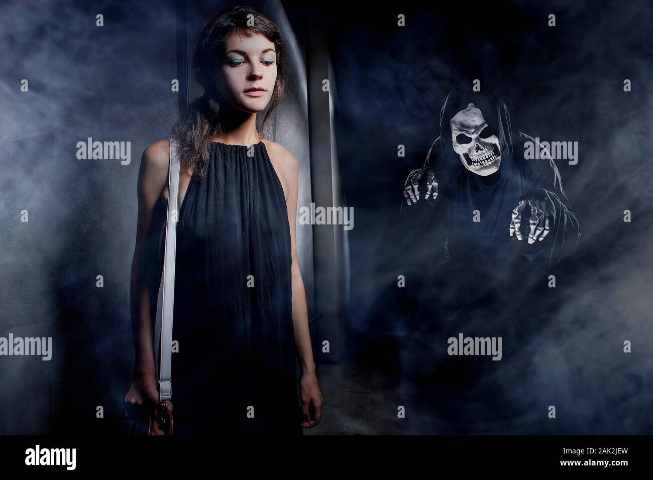 Woman in a dark alley with fog or mist imagining or seeing a demon or