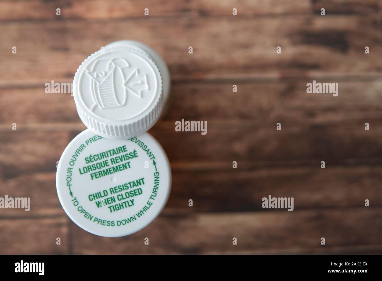 Child proof cover on prescription medicine bottles Stock Photo Alamy