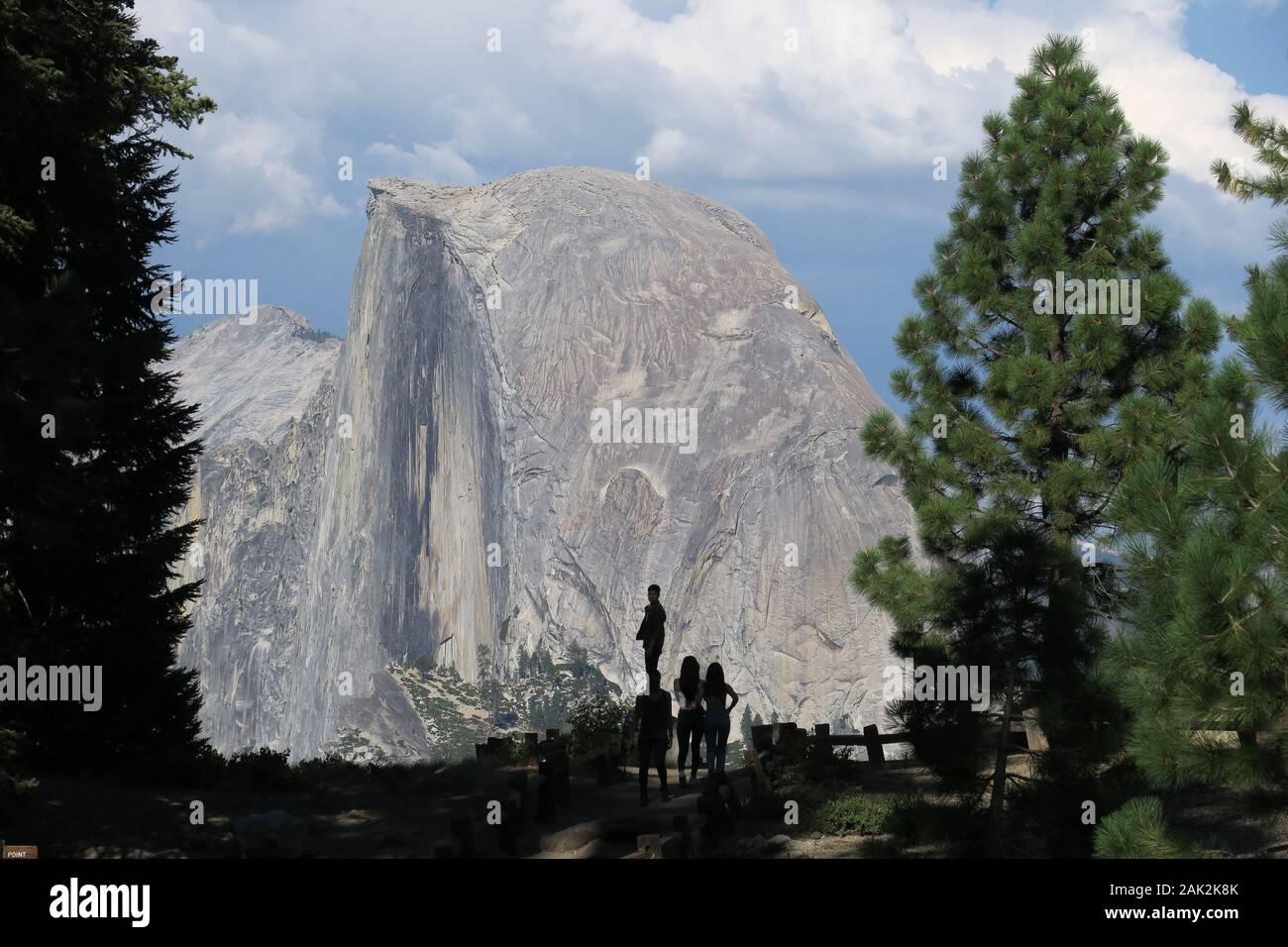 Tourist silhouettes standing with Half Dome - Glacier Point, Yosemite Stock Photo