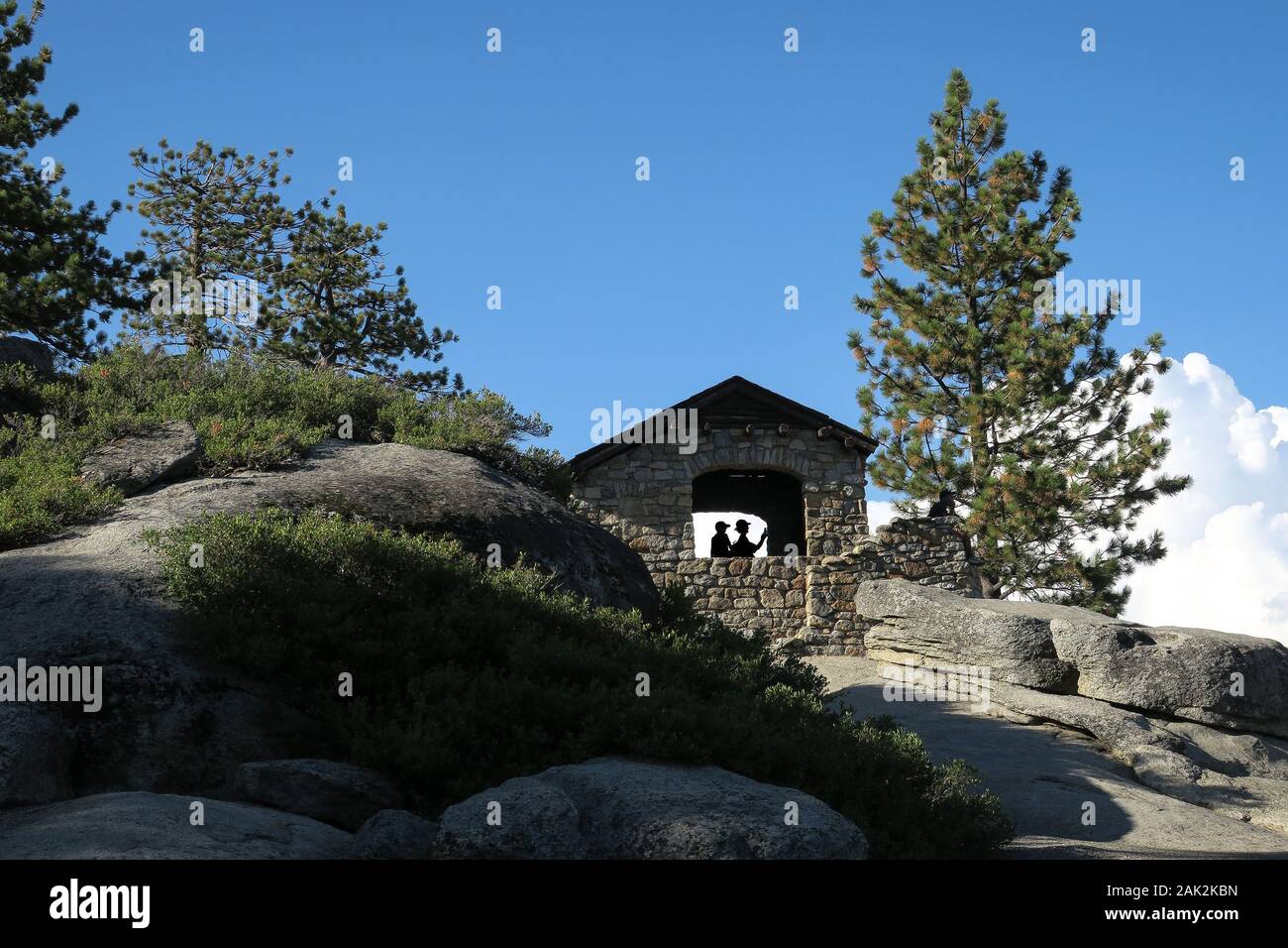 Viewpoint Structure With Tourist Silhouettes at Glacier Point, Yosemite Stock Photo
