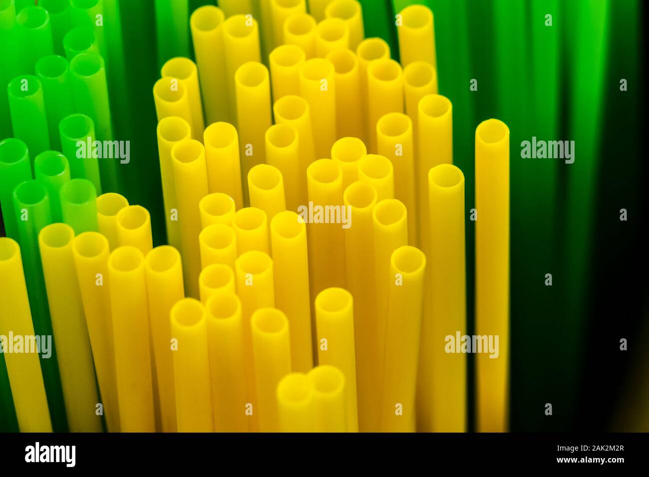 Many colored plastic tubes for drinks close-up. Stock Photo