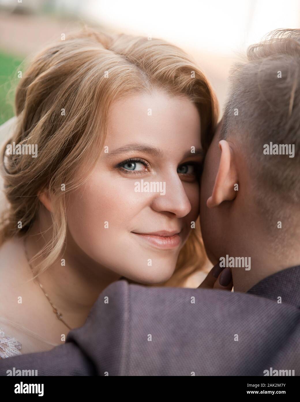 top view. happy bride and groom sitting on a bench Stock Photo - Alamy