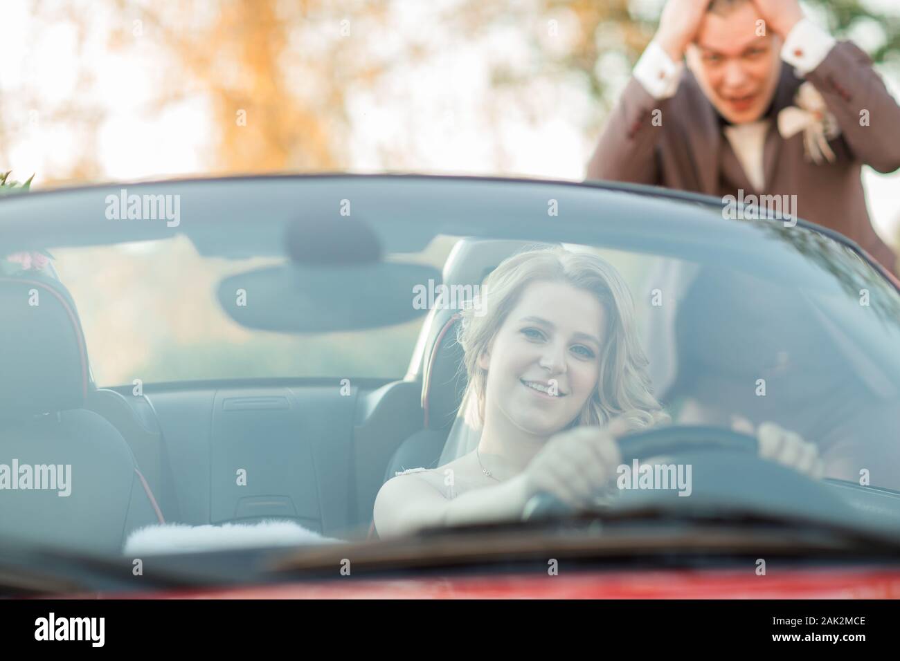 bride leaving by car from her groom Stock Photo - Alamy