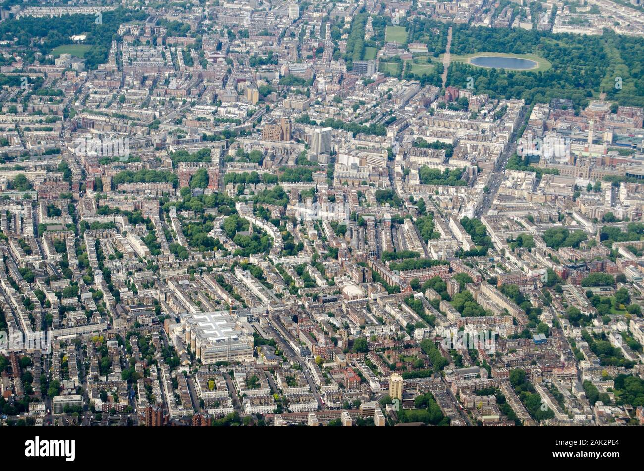 Aerial view looking north across the wealthy districts of Chelsea and West Kensington with Hyde Park to the top of the picture on a sunny morning in L Stock Photo