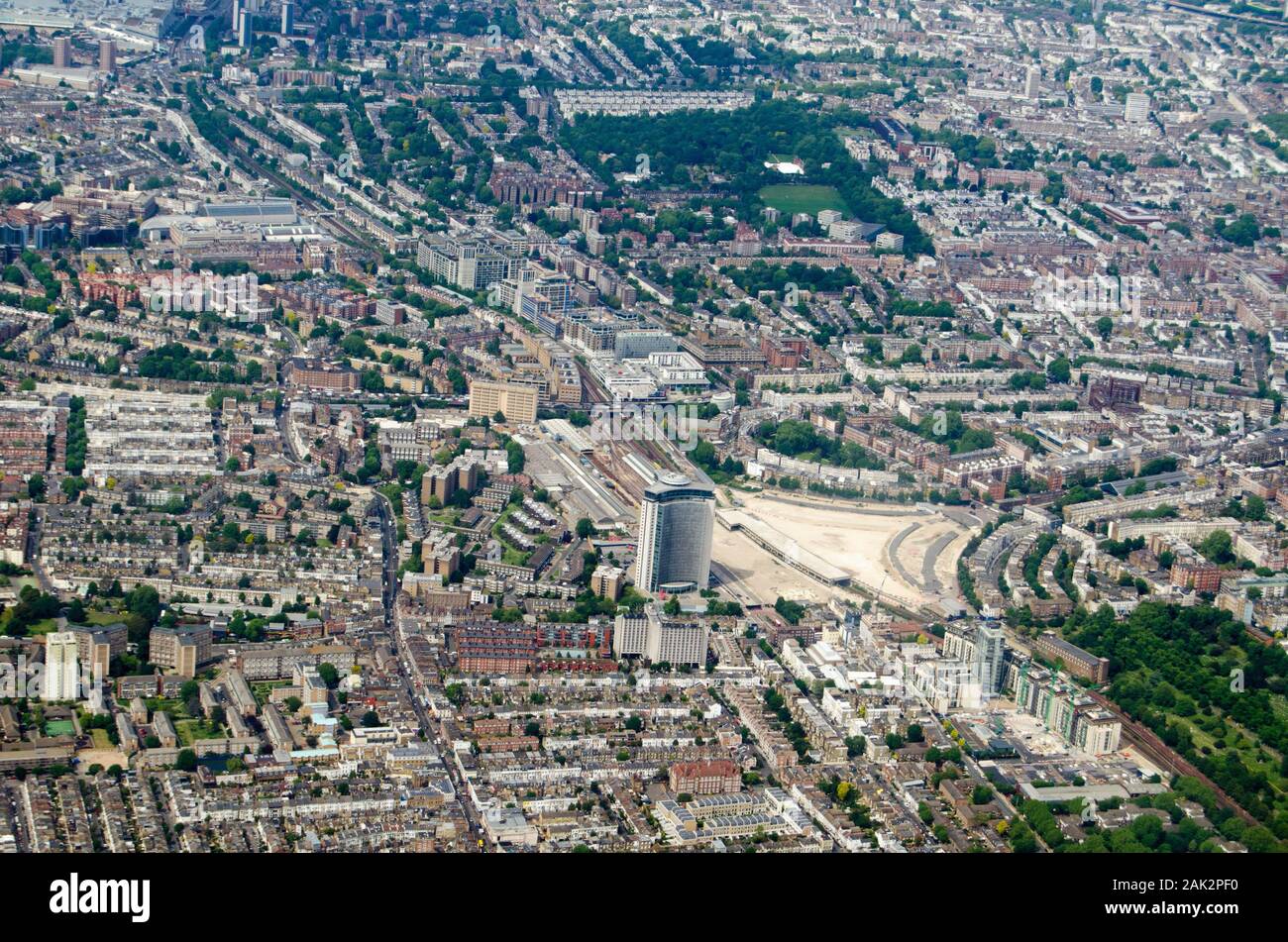 Aerial view looking north across Earls Court and Holland Park districts of central London on a sunny morning.  The Empress State Building is towards t Stock Photo
