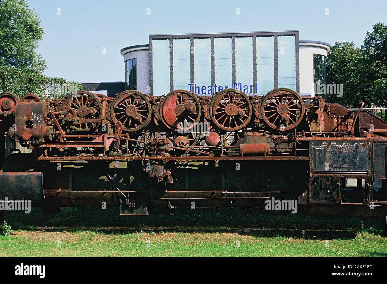 In the sculpture park of the city Marl you find the upside down war-goods-train-locomotive, called La Tortuga (the turtle). In the background the thea Stock Photo