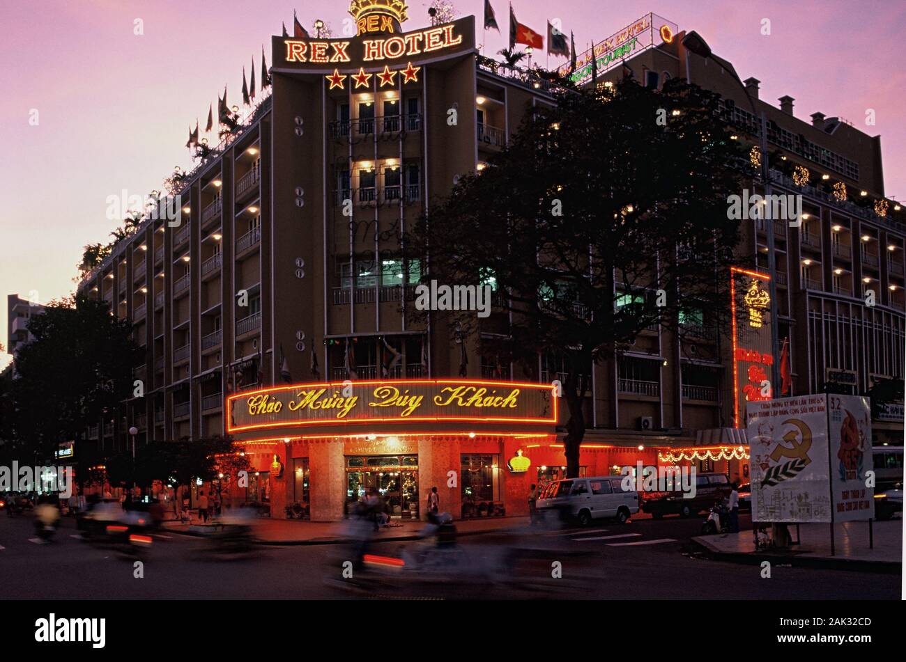 Brightly lighted is the popular Rex Hotel in the nocturnal Ho Chi Minh City, that is the biggest city of Vietnam and is located in the south of the So Stock Photo