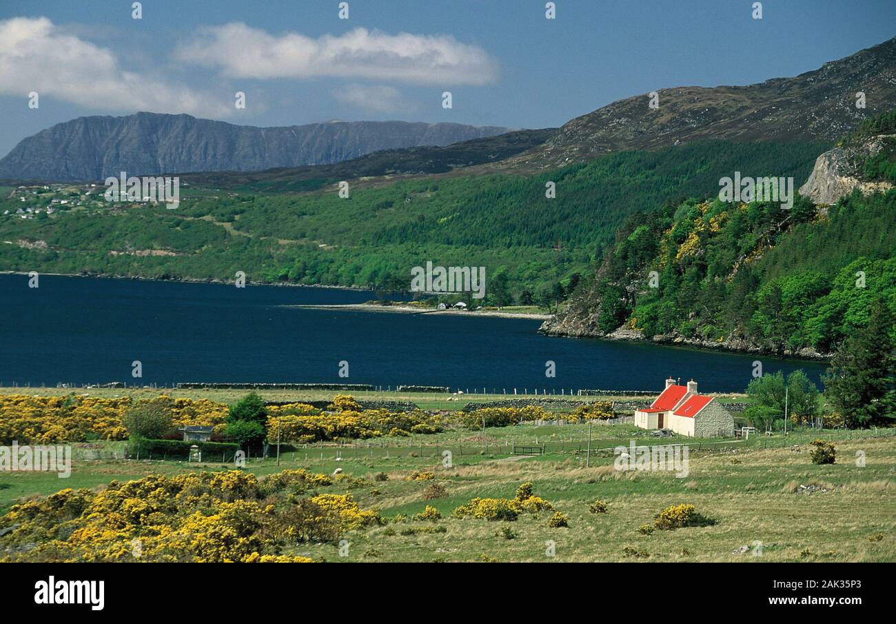 A cottage is picturesque situated at Loch Broom in the north of