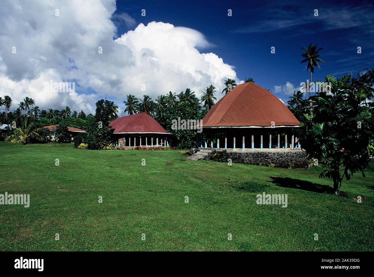 Traditional Samoan houses, the socalled fales, stand on an island of