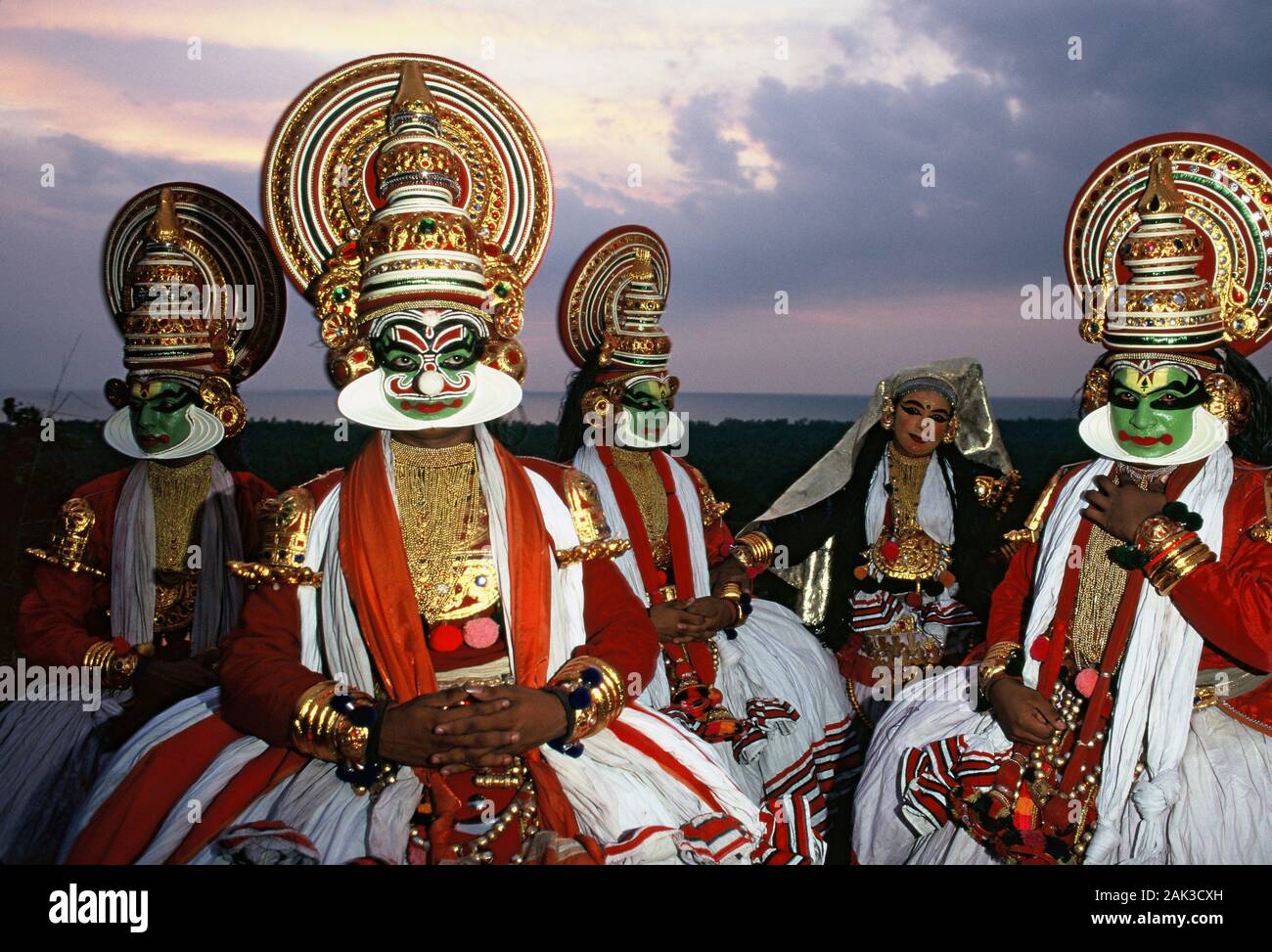 Colorful rouged kathakali dancers performing a dance in the federal state of Kerala in Southern ...