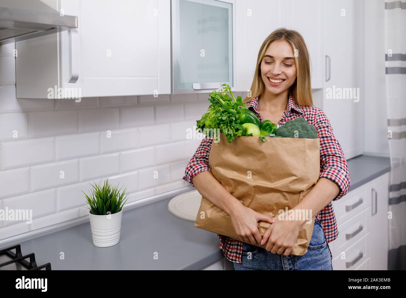 Young Woman is Contented With the Greengrocery Purchases Stock Photo