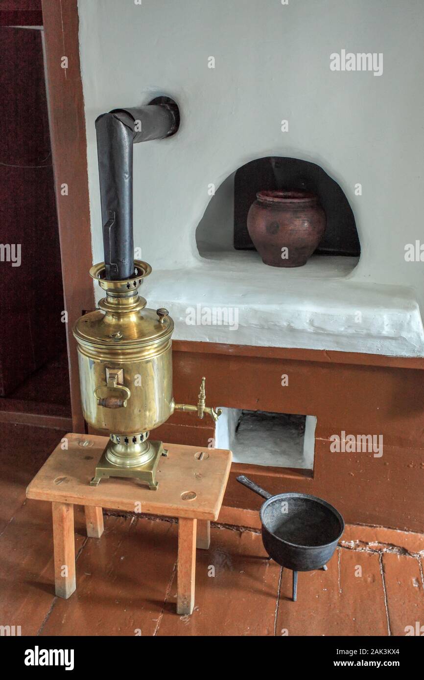 Old russian samovar and old russian stove Stock Photo
