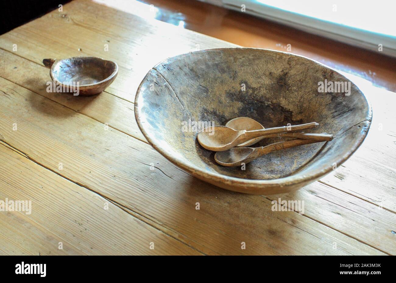 Old Russian wooden dishes on a wooden table Stock Photo