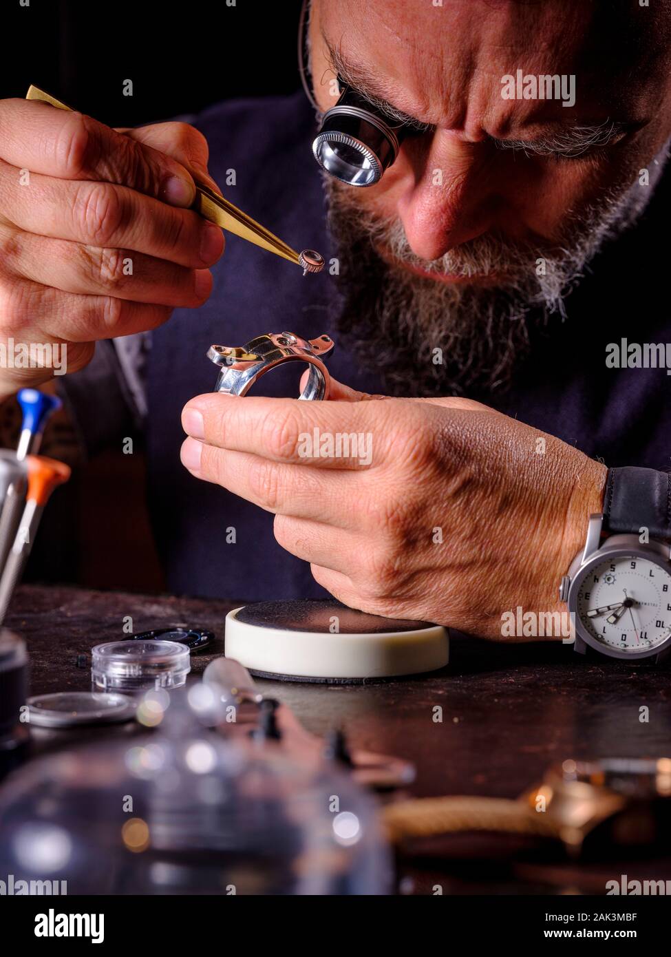 Luxury watchmaker Giles Ellis of Schofield Watches at his West Sussex workshops UK. Stock Photo