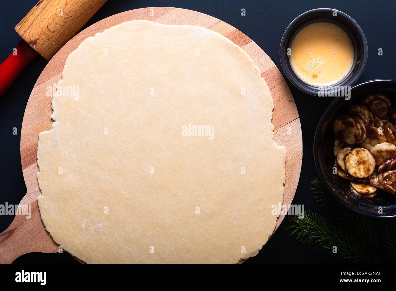 Food concept processing to make Homemade Banana foster hand pie on black background Stock Photo