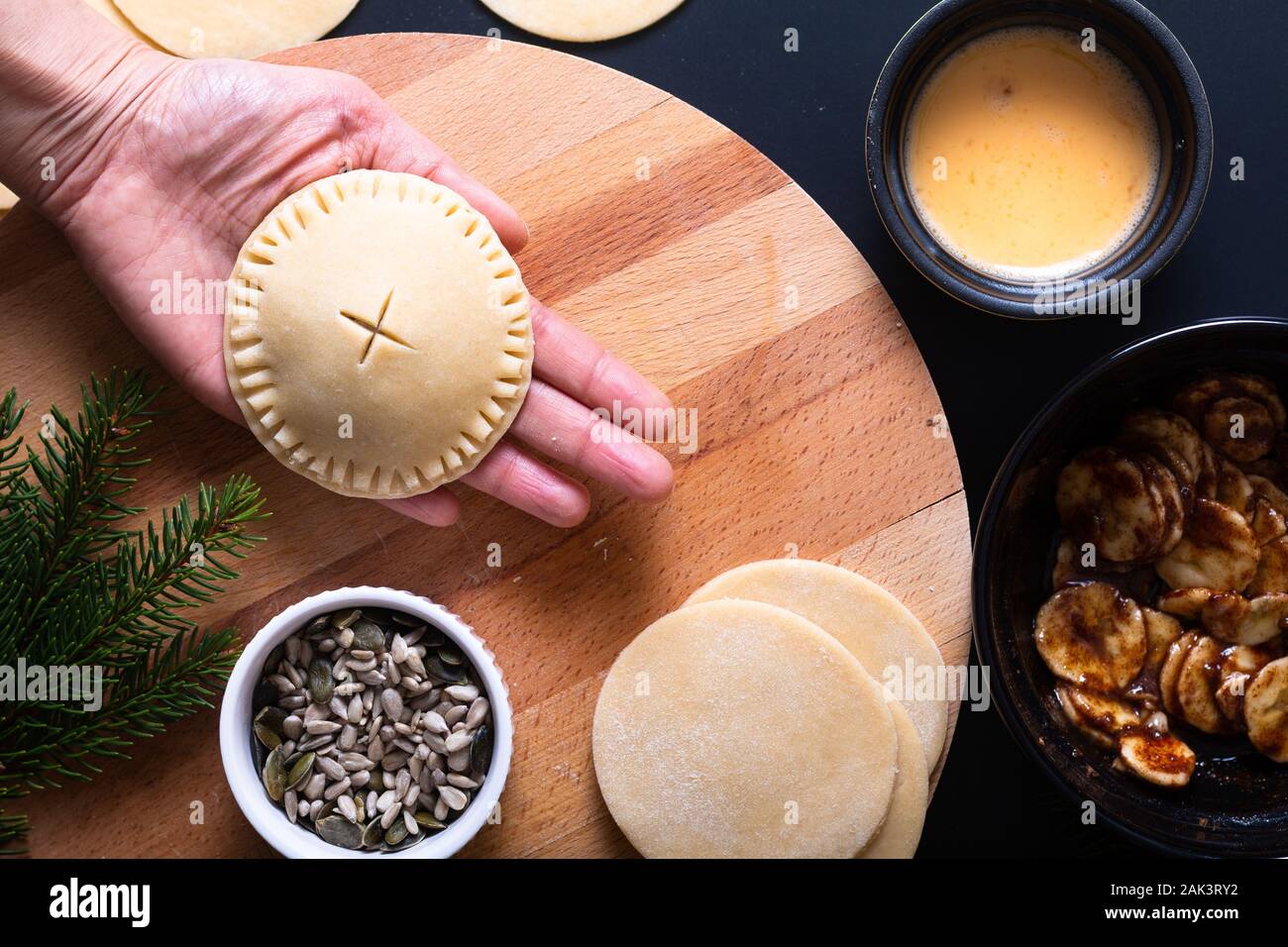 Food concept processing to make Homemade Banana foster hand pie on