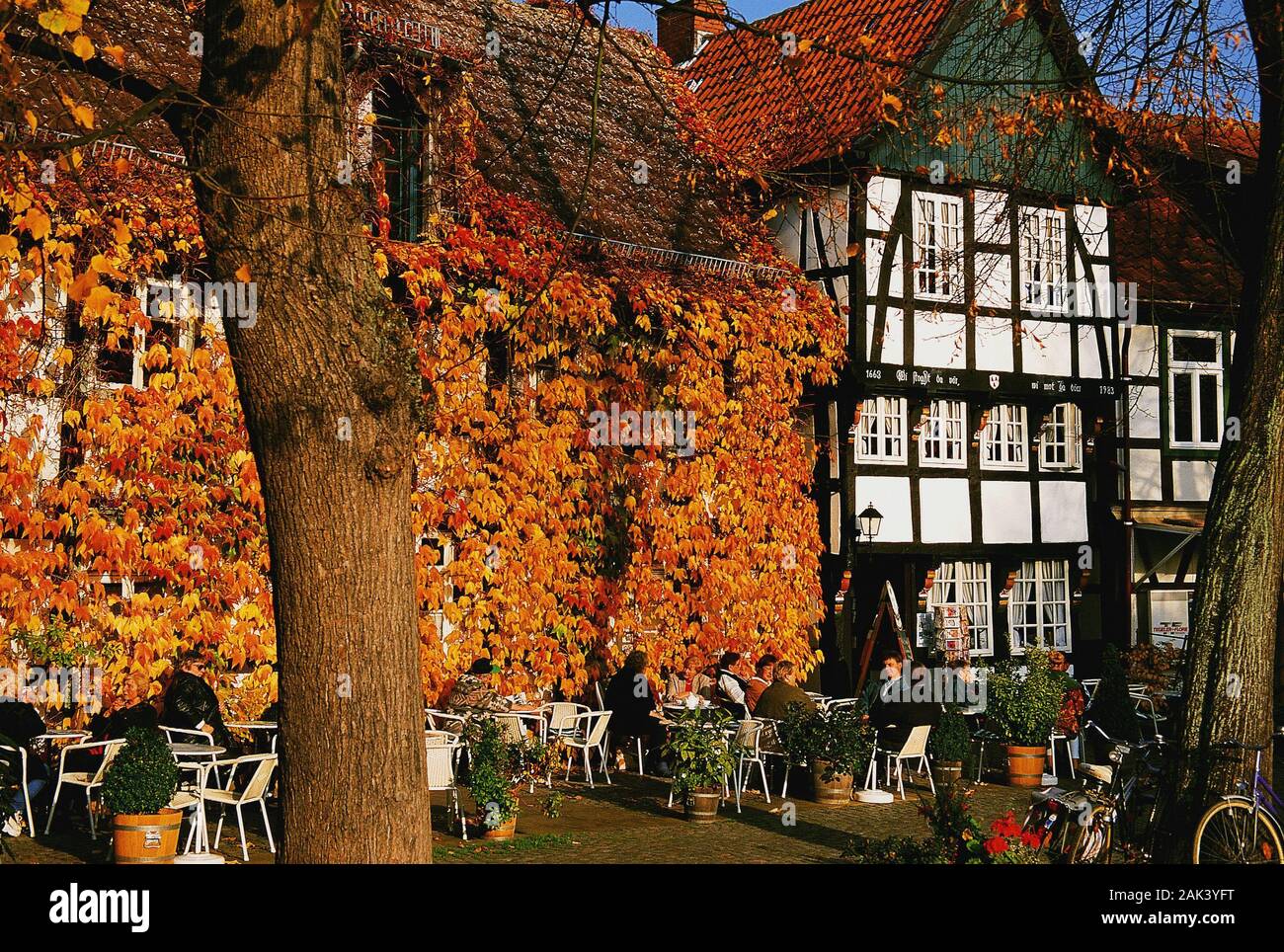 Guests enjoy the fall on the market place in Bad Essen in the Osnabrück  country, Germany. The market place is regarded as one of the most beautiful  in Stock Photo - Alamy