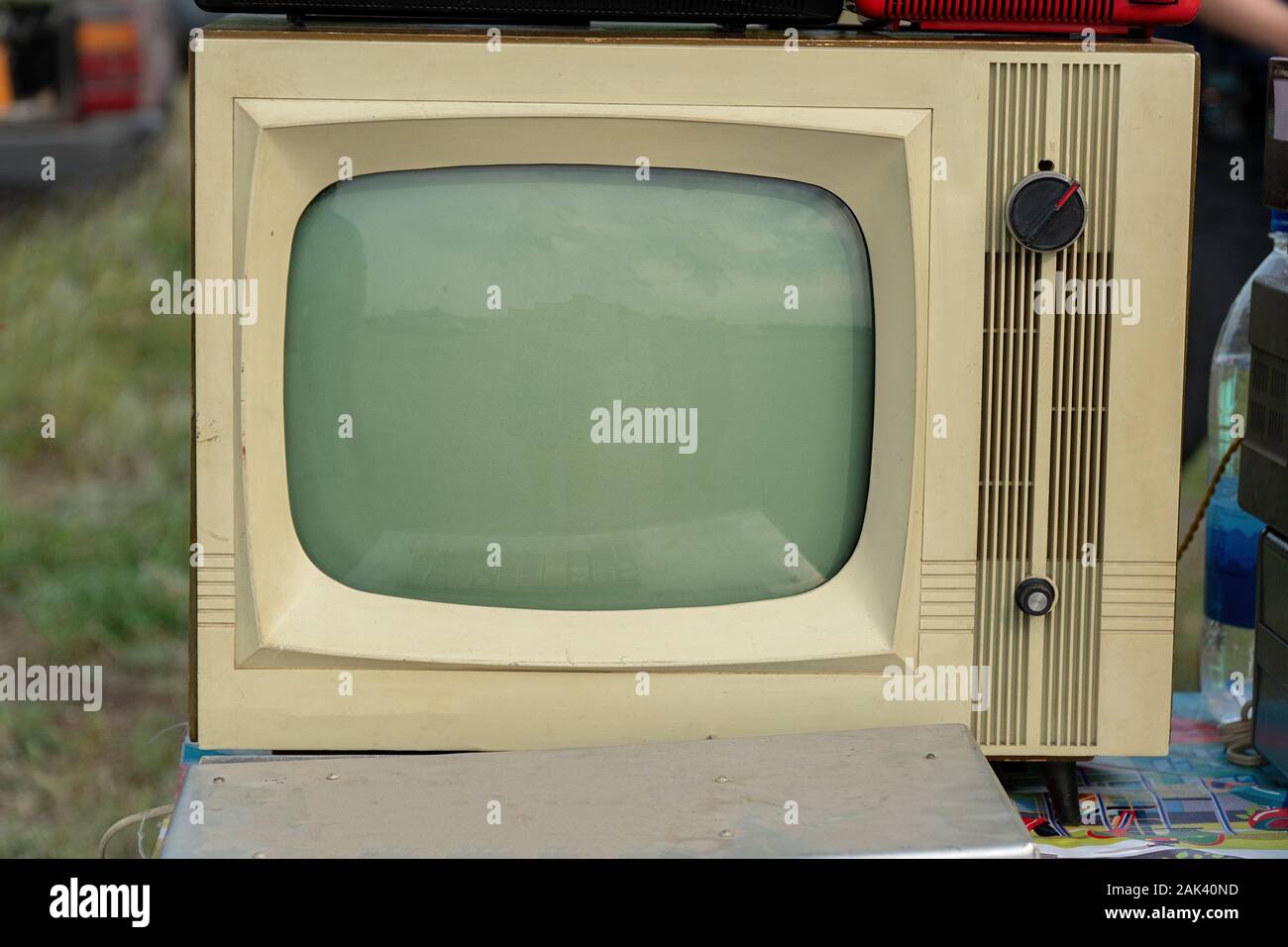 An old-fashioned analog TV in gray with a kinescope.Retro electronics Stock Photo