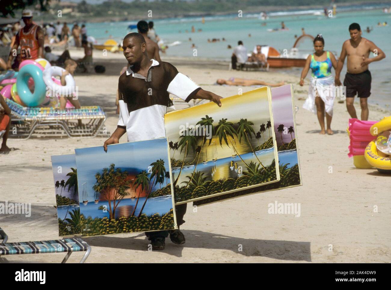 Dominican Republic Boca Chica Man selling Caribbean Paintings on the