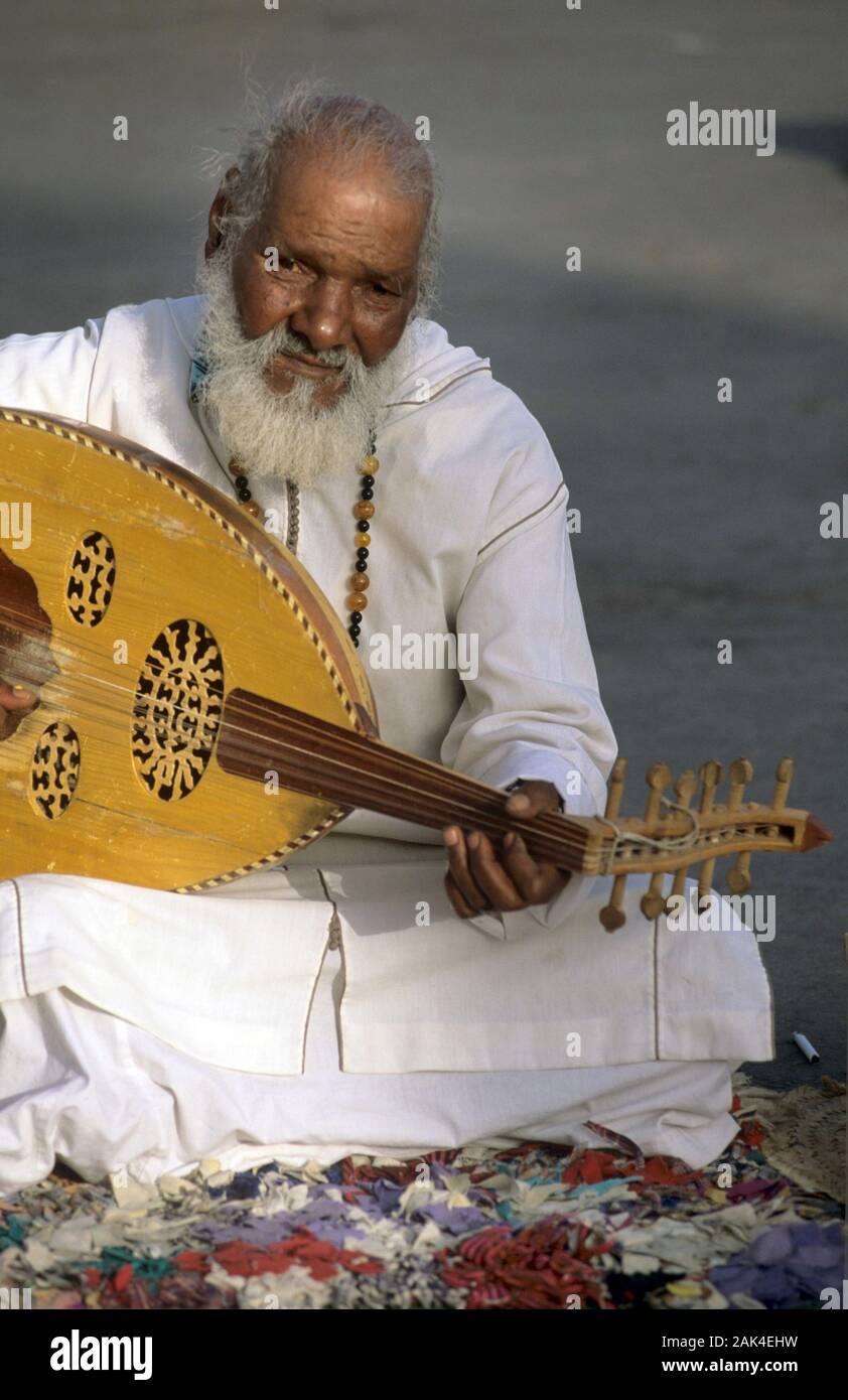 Morocco: Marrakech - Old Man playing an Oriental Musical Instrument ...
