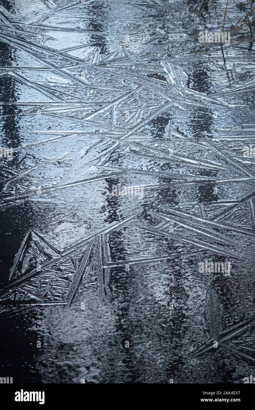 Frozen Ice patterns at Abernethy  in the Cairngorms National Park of Scotland. Stock Photo