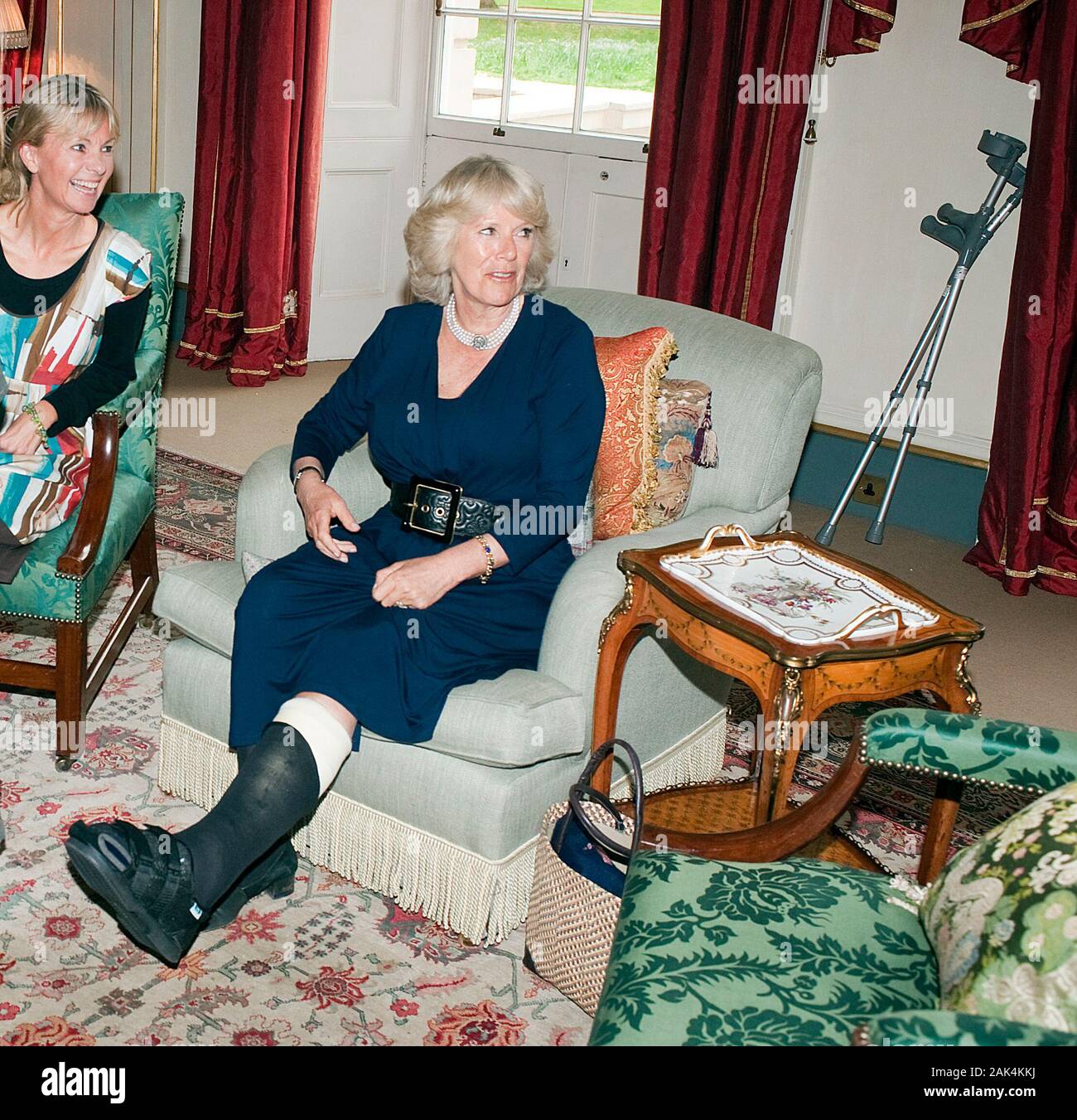 The Duchess of Cornwall with her leg in plaster following a walking accident in Balmoral meeting with members of the Orange Prize Youth Panel at Clarence House in London in 2010. Stock Photo