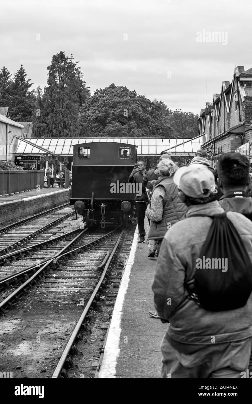 Man is wait for railway arrive at the station platform, Haverthwaite Railway, Lake District, UK Stock Photo