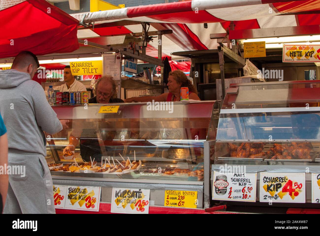 People buying food to eat in a street market Stock Photo