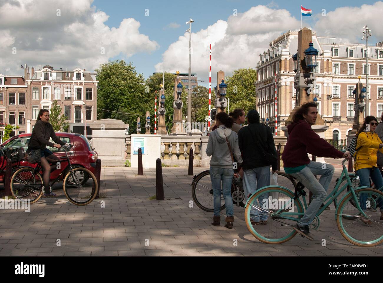 People riding bicyle in the city in a sunny day Stock Photo