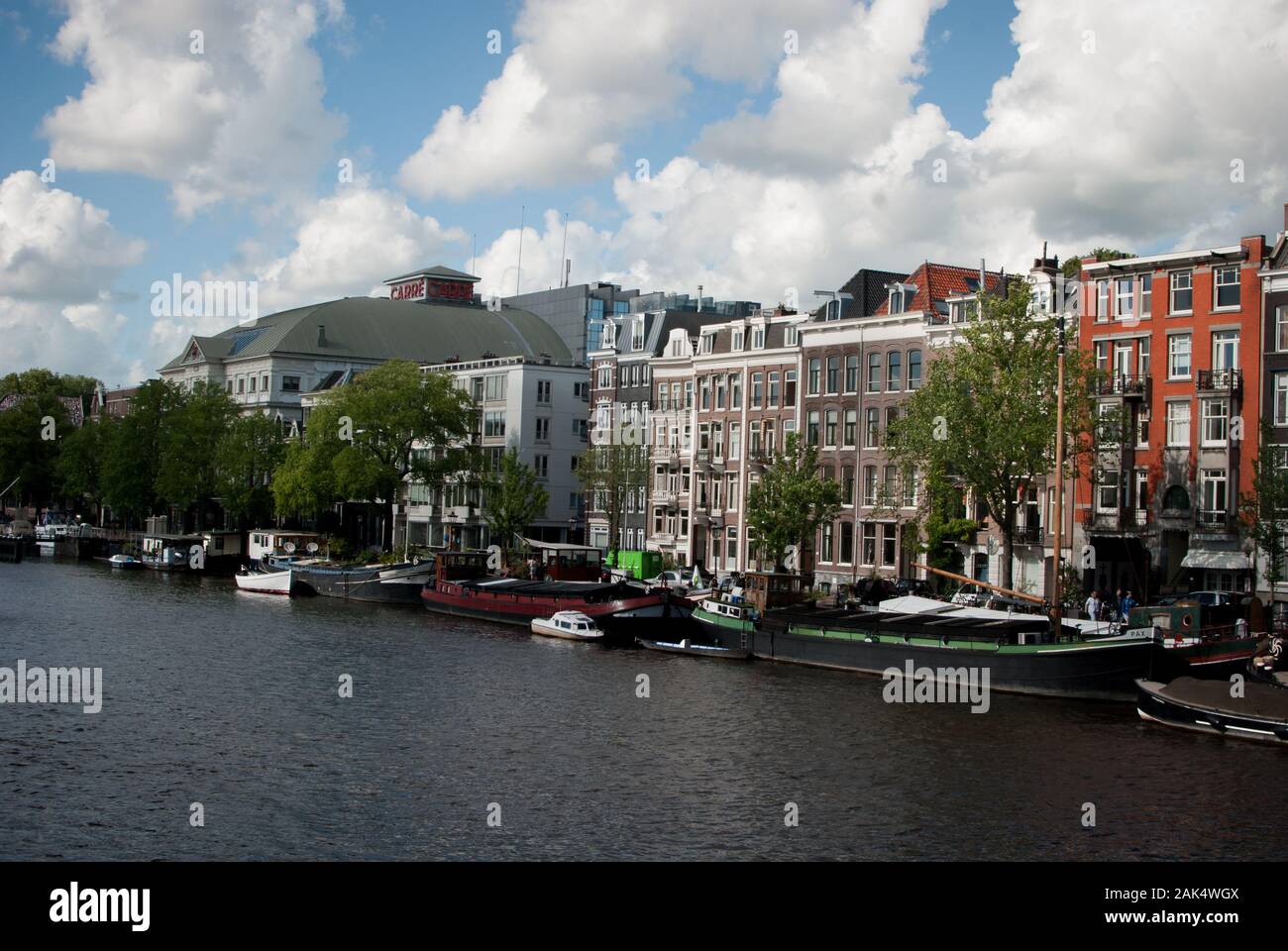 Amsterdam river trees and buildings Stock Photo