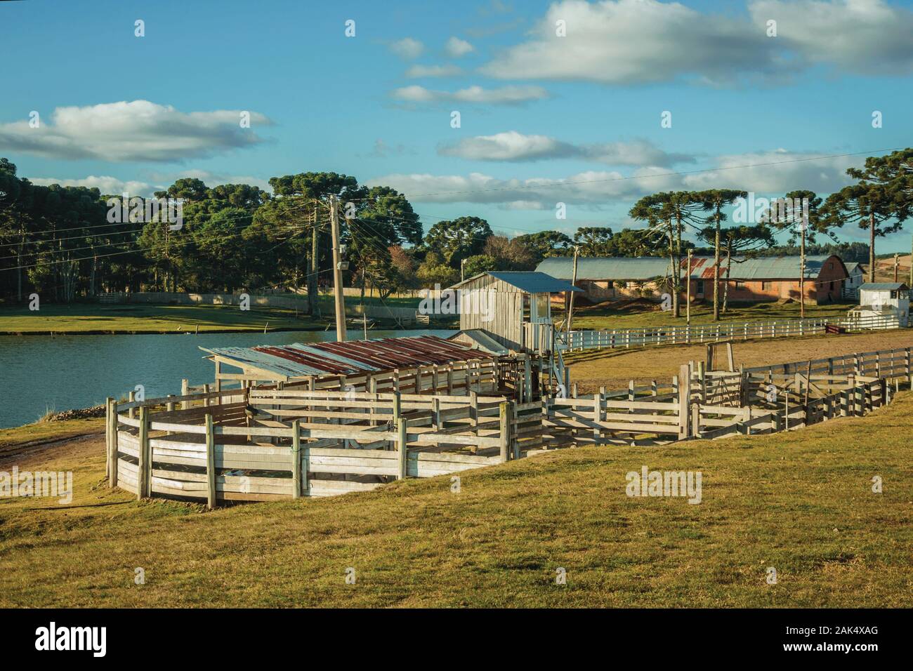 Farm with fences, livestock sheds and blue lake near Cambara do Sul. A town with natural tourist sights in southern Brazil. Stock Photo