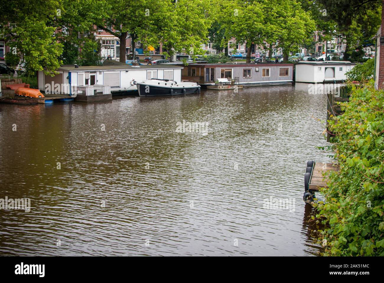 House floating over the river in Amsterdam Stock Photo