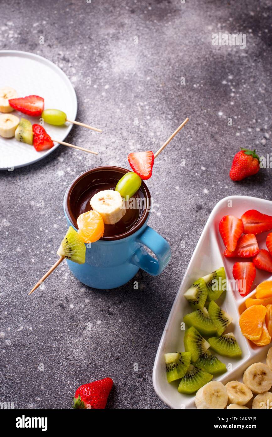 Sweet chocolate fondue with fruits Stock Photo Alamy