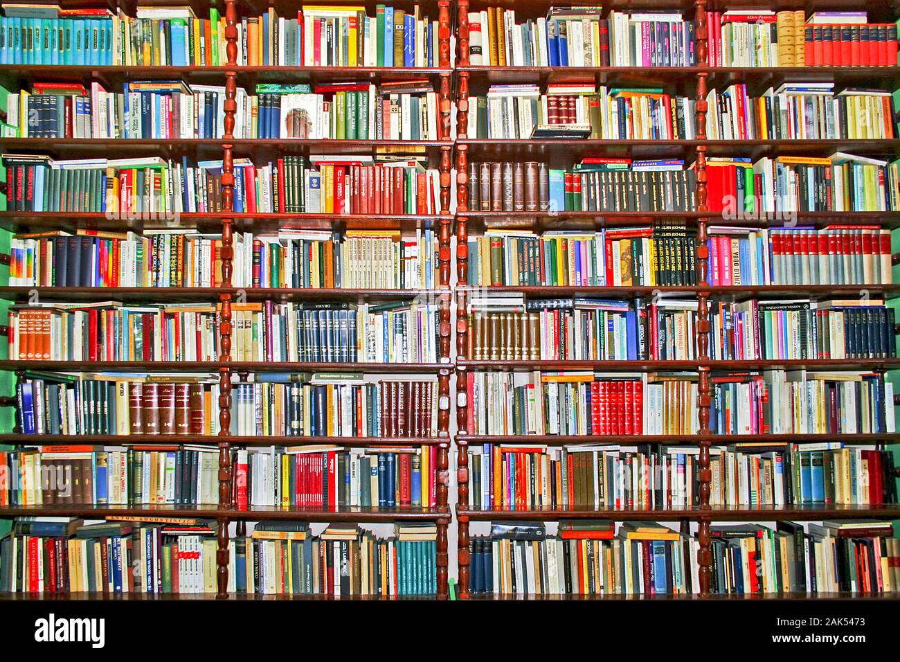 Whole big wall covered with lot of books Stock Photo Alamy