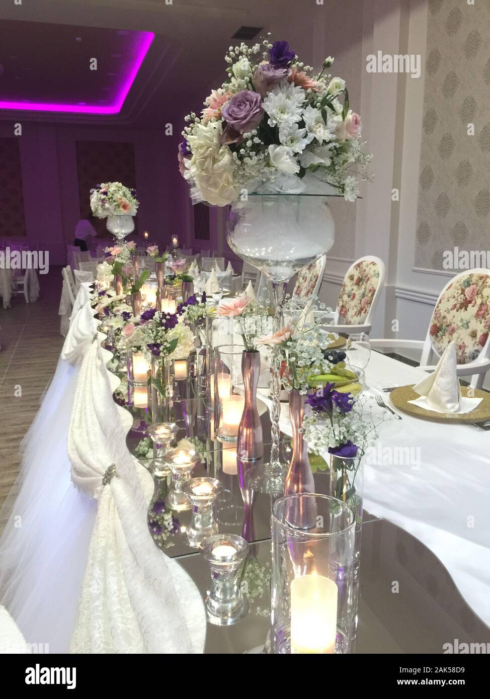 Bride And Groom Table Decorated With Flowers And Candles Image