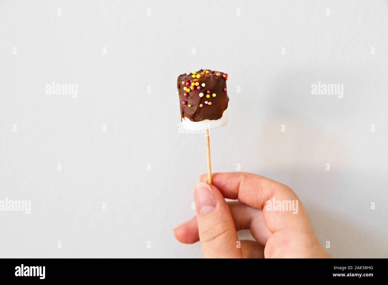 Cake pops candy sticks decorated with dark chocolate. Stock Photo